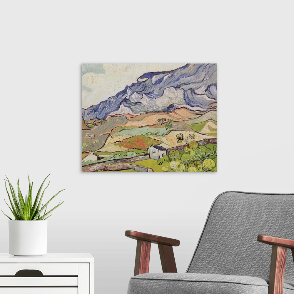 A modern room featuring Large, landscape, classic painting of the Alpilles mountains looming over a farming landscape of ...