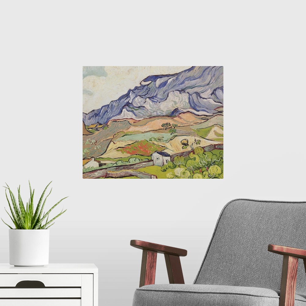 A modern room featuring Large, landscape, classic painting of the Alpilles mountains looming over a farming landscape of ...