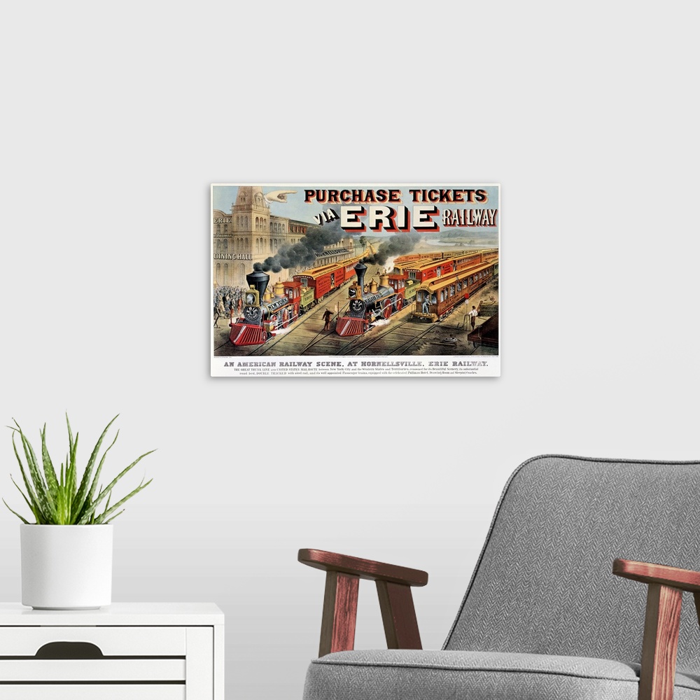 A modern room featuring Vintage poster of two trains pulling out of the station which is viewed to the left.