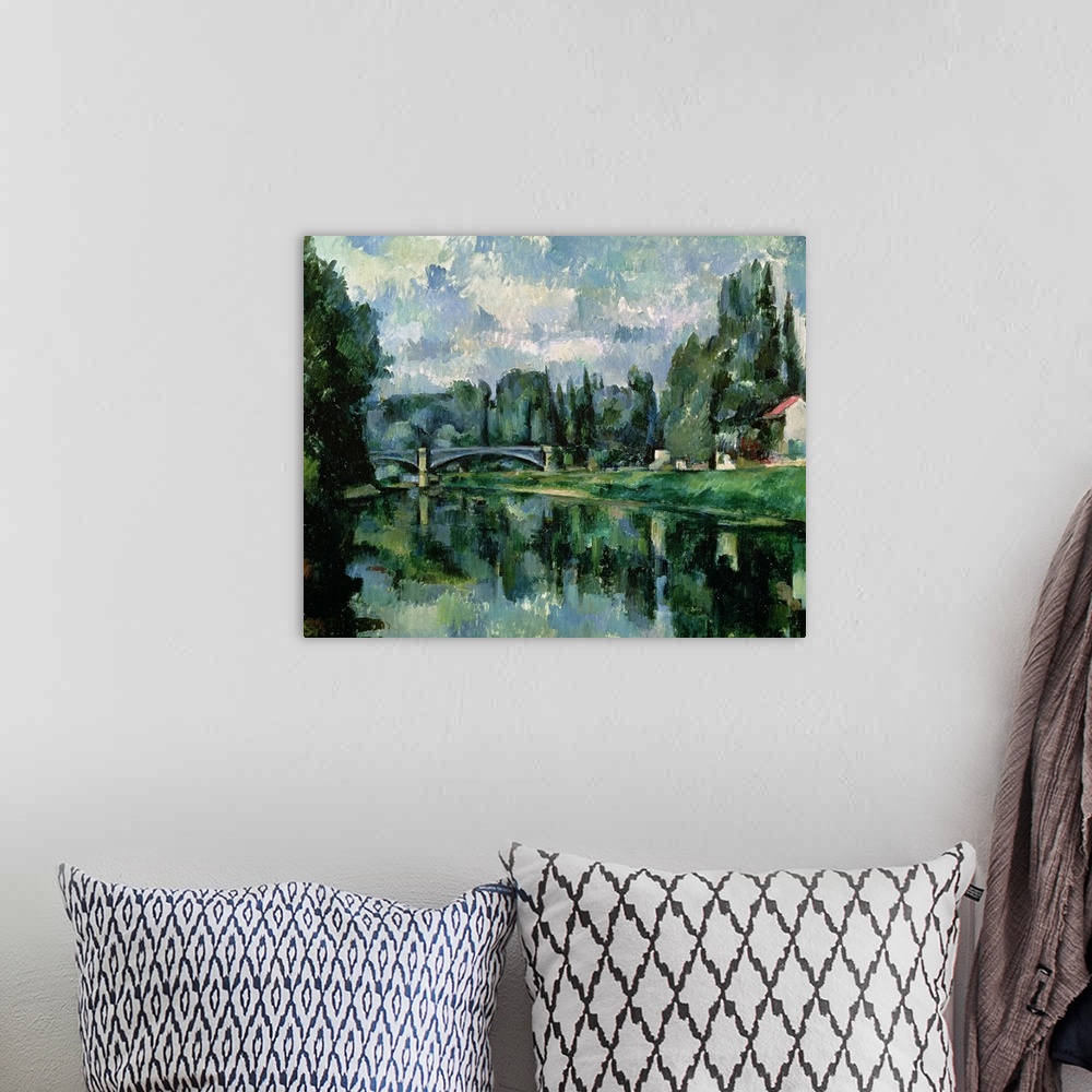 A bohemian room featuring Classical oil painting on canvas of a river with a bridge going across it with a dense forest and...