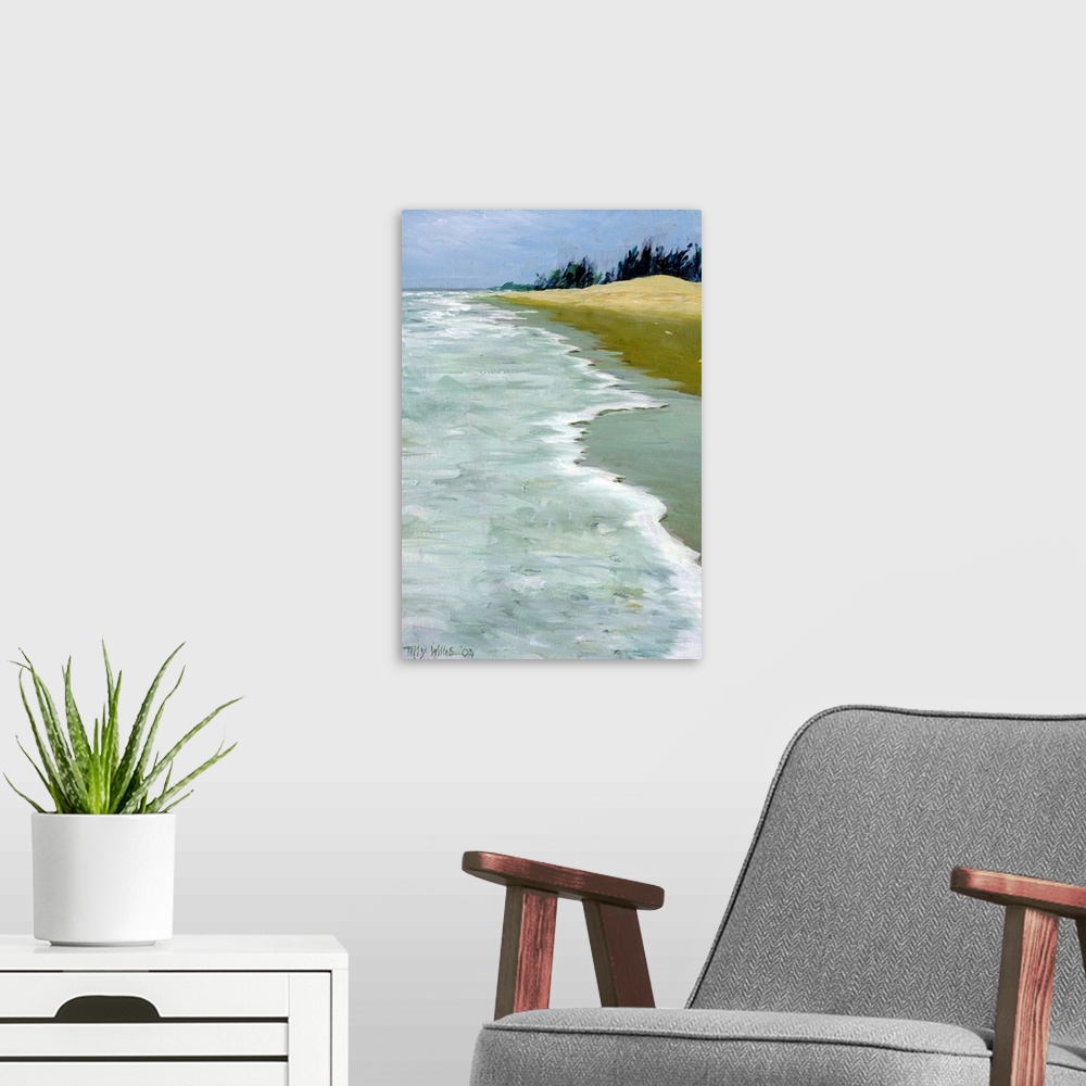 A modern room featuring This is a contemporary painting showing waves rocking against the shore of a sandy beach on a ver...