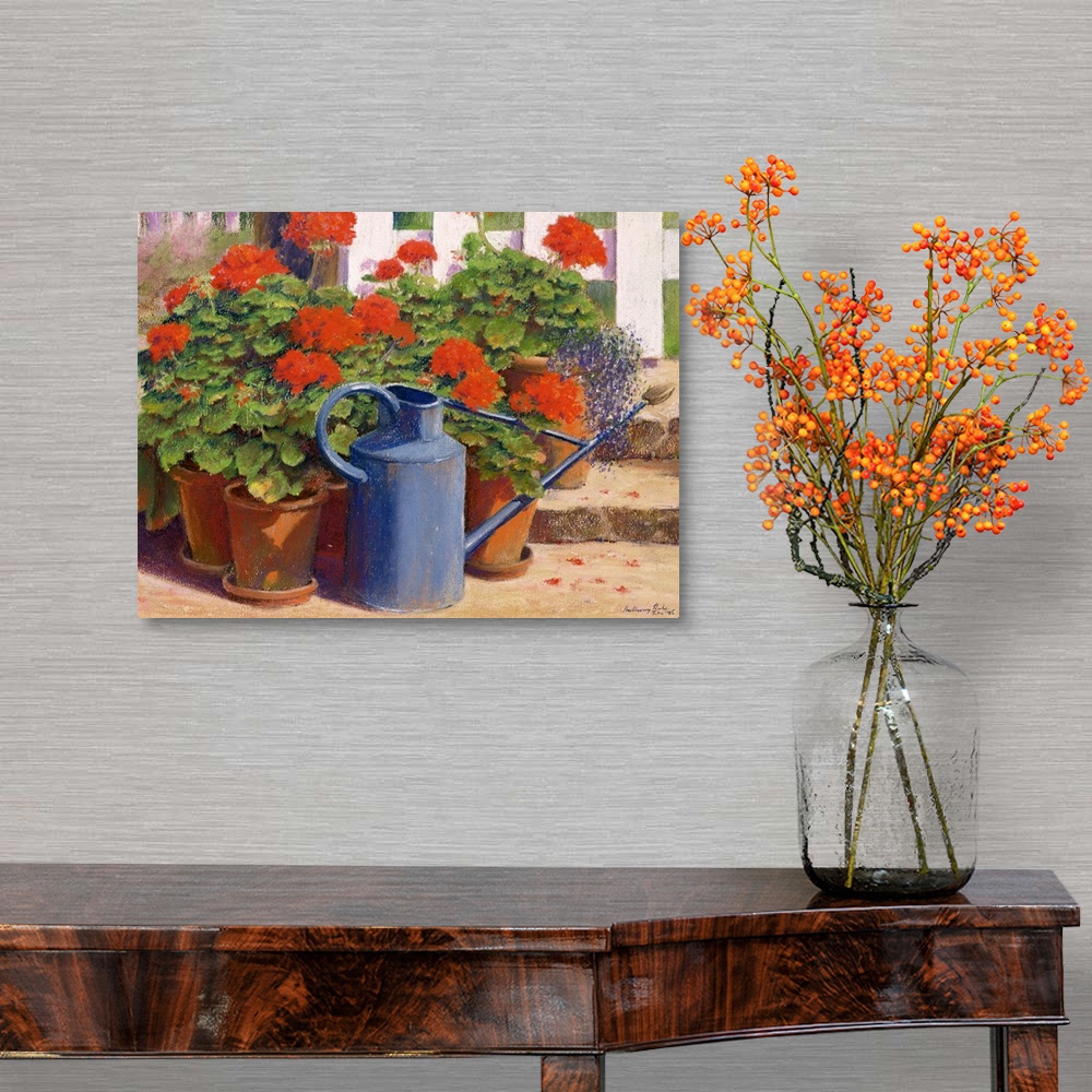 A traditional room featuring Docor perfect for the home of painted potted flowers with a watering can in front.