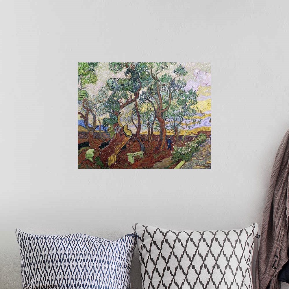 A bohemian room featuring Large, horizontal classic painting of a line of trees with curvy bunches of leaves, alongside a w...