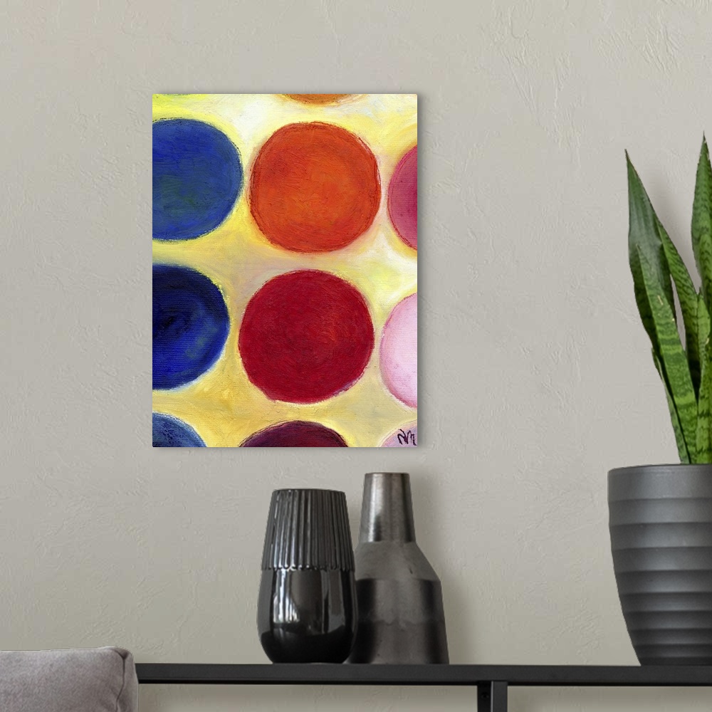 A modern room featuring Contemporary painting of a colorful circles against a yellow background.