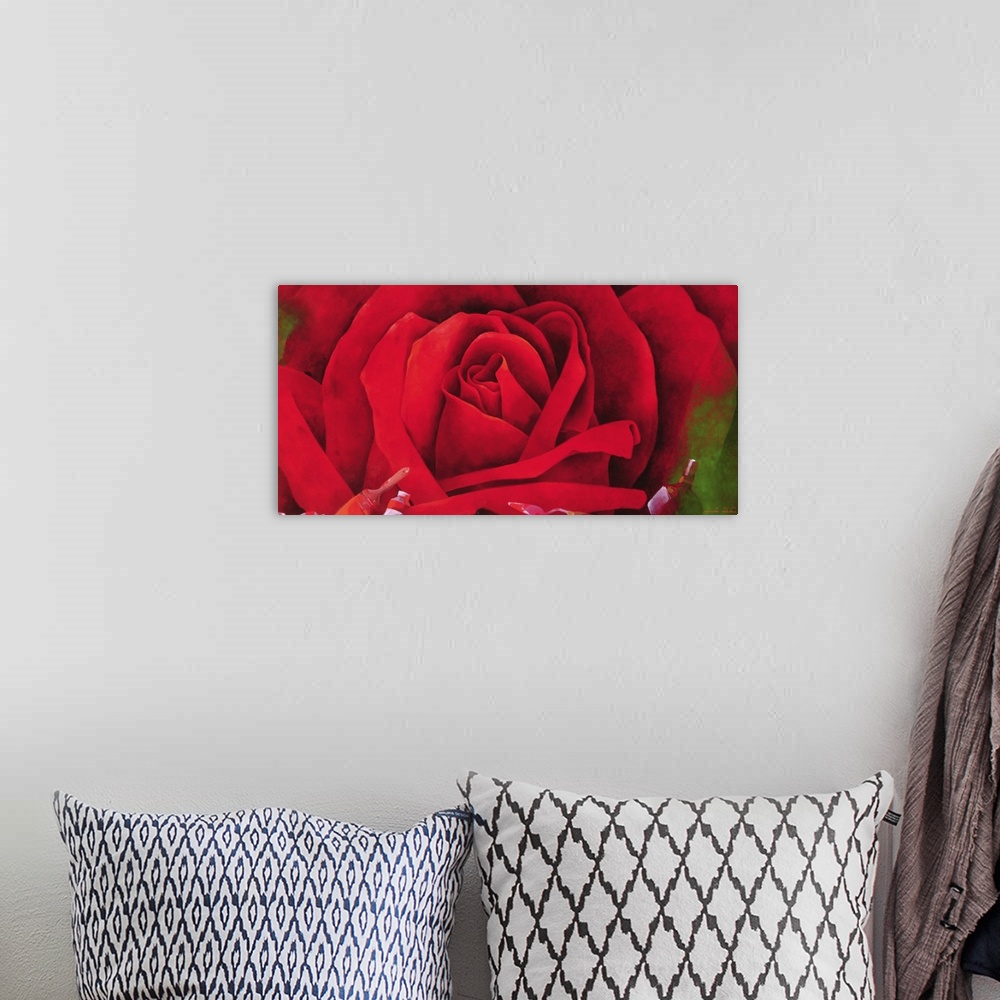 A bohemian room featuring Giant, horizontal, close up painting of a blooming red rose with green leaves on the outer edges....