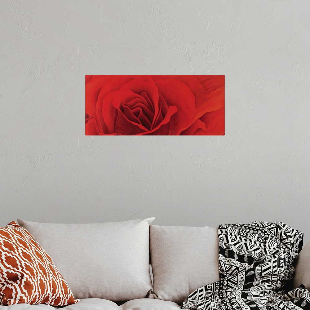 A bohemian room featuring A panoramic shaped painting of close up of a rose blossom.