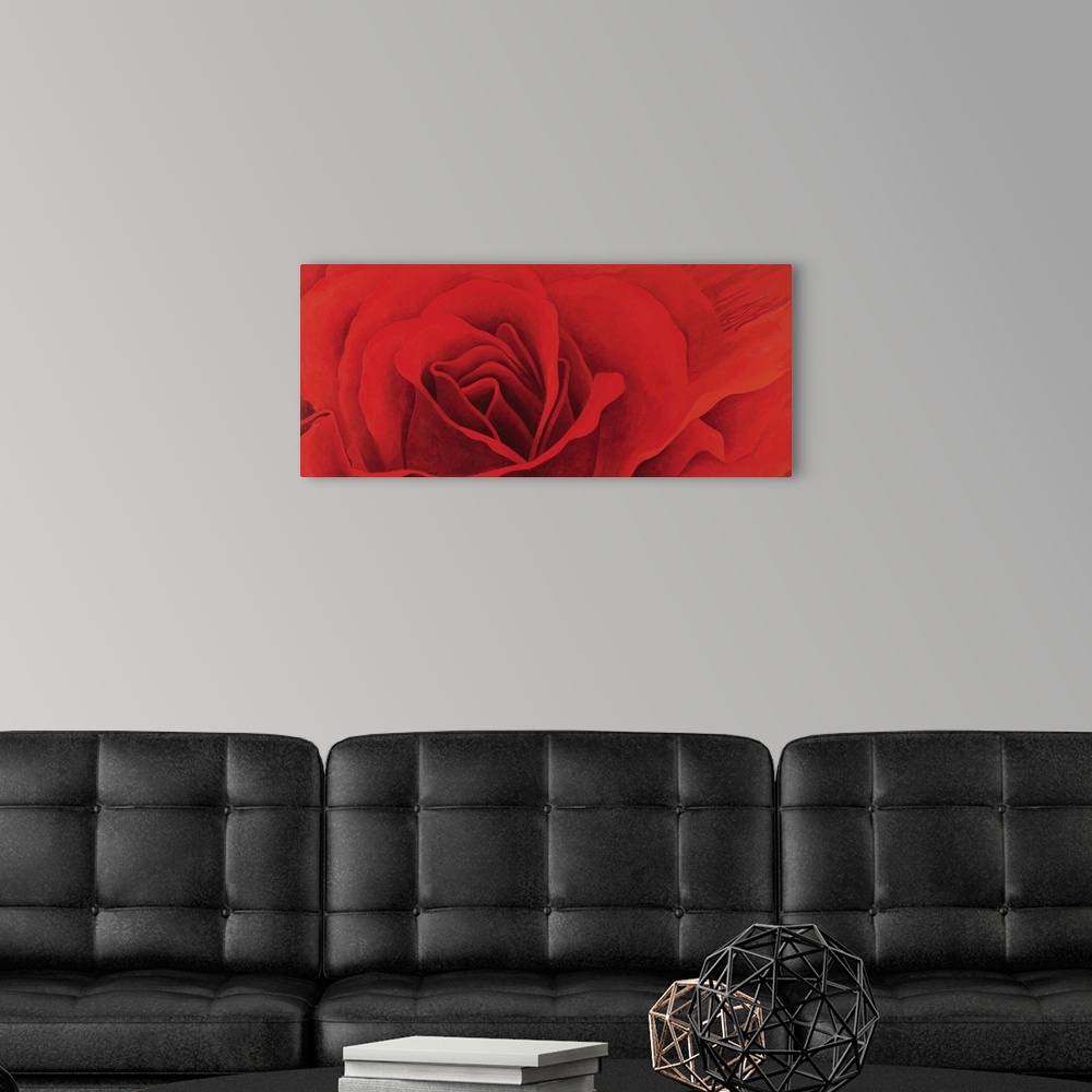 A modern room featuring A panoramic shaped painting of close up of a rose blossom.