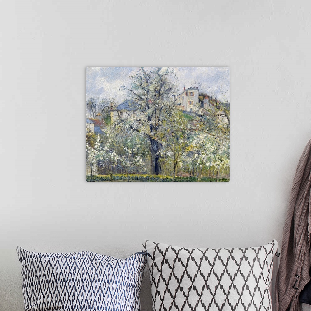 A bohemian room featuring Classic artwork of a garden with trees that hide a small town just behind it and on top of a hill.