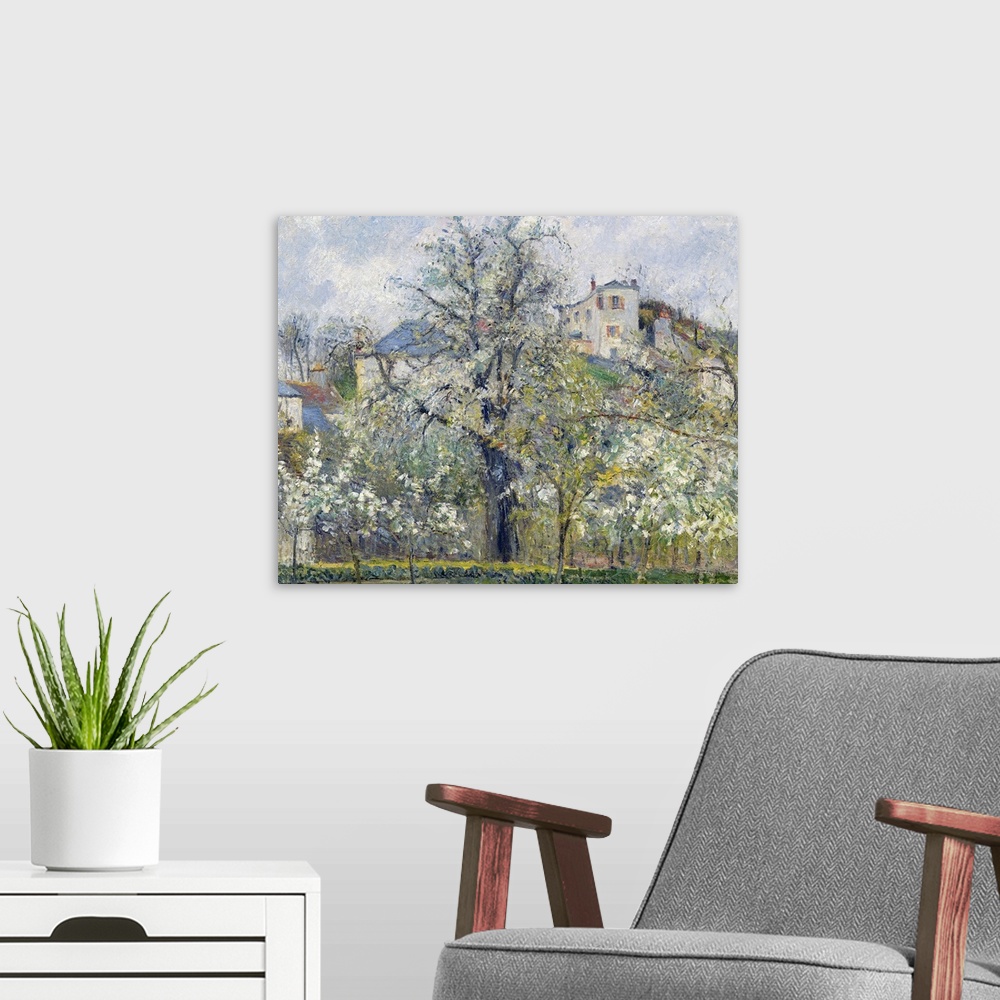 A modern room featuring Classic artwork of a garden with trees that hide a small town just behind it and on top of a hill.
