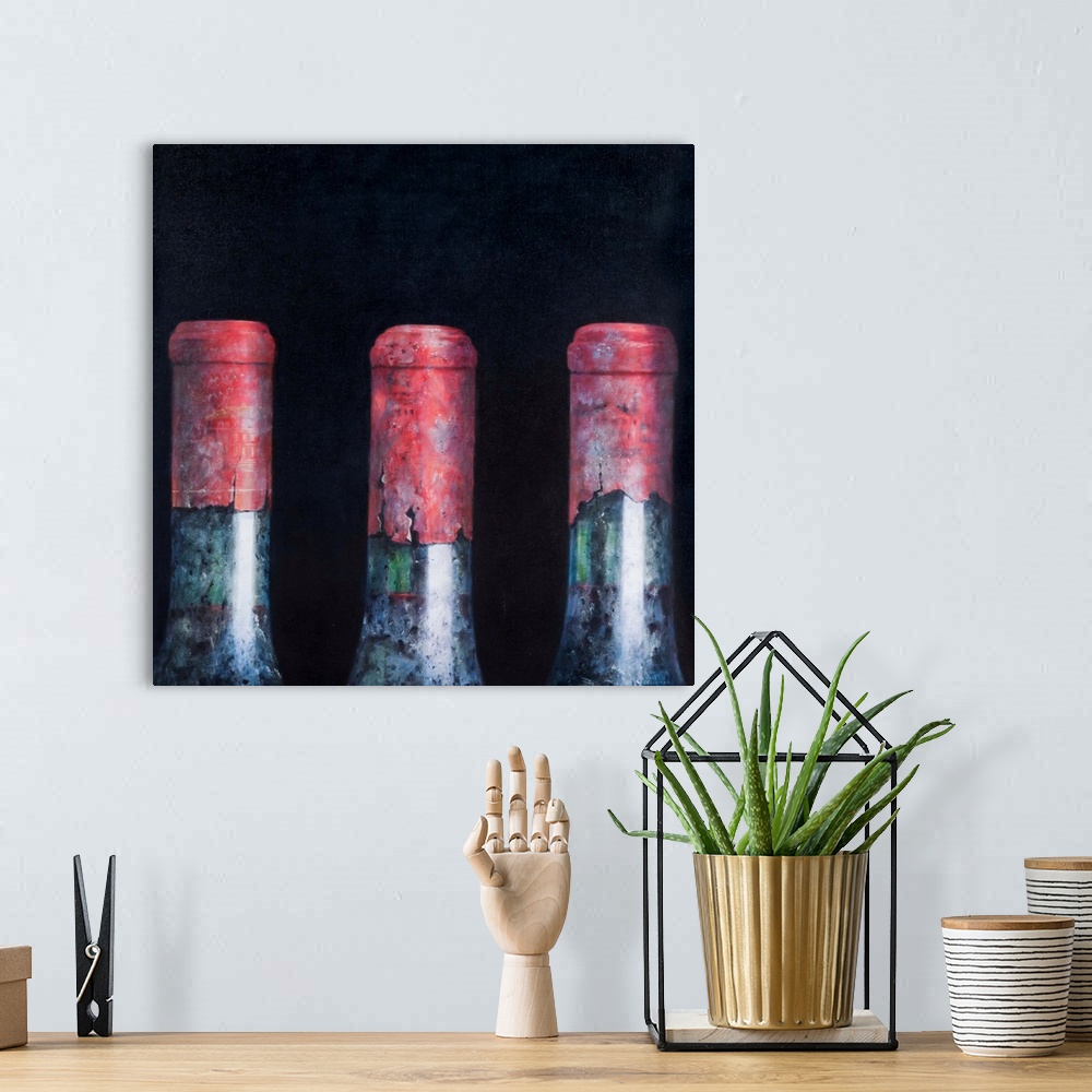 A bohemian room featuring Contemporary still life of the tops of three wine bottles.