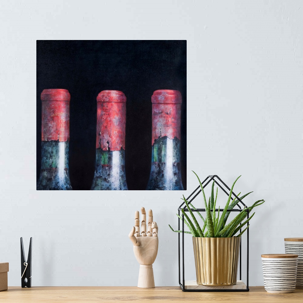 A bohemian room featuring Contemporary still life of the tops of three wine bottles.