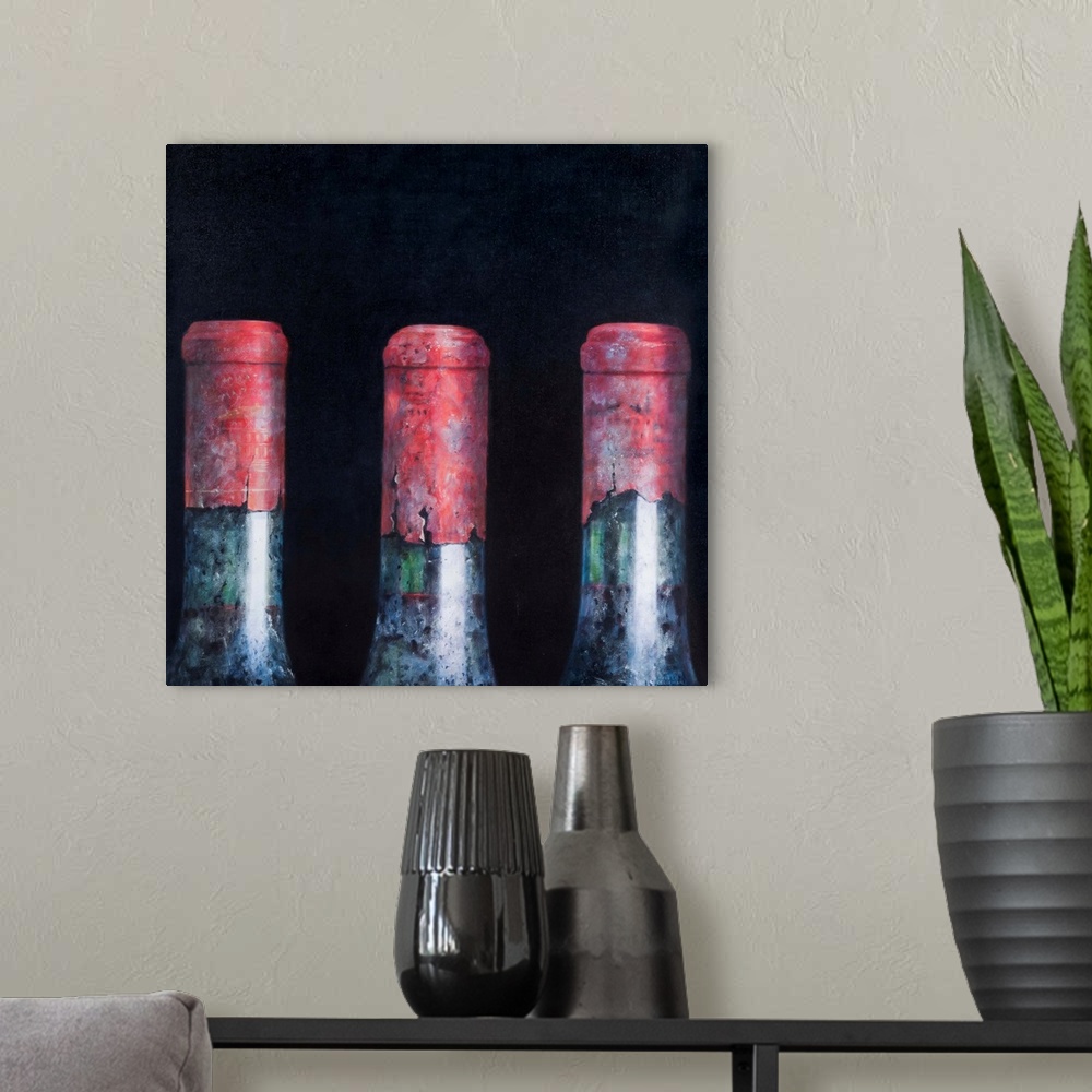 A modern room featuring Contemporary still life of the tops of three wine bottles.