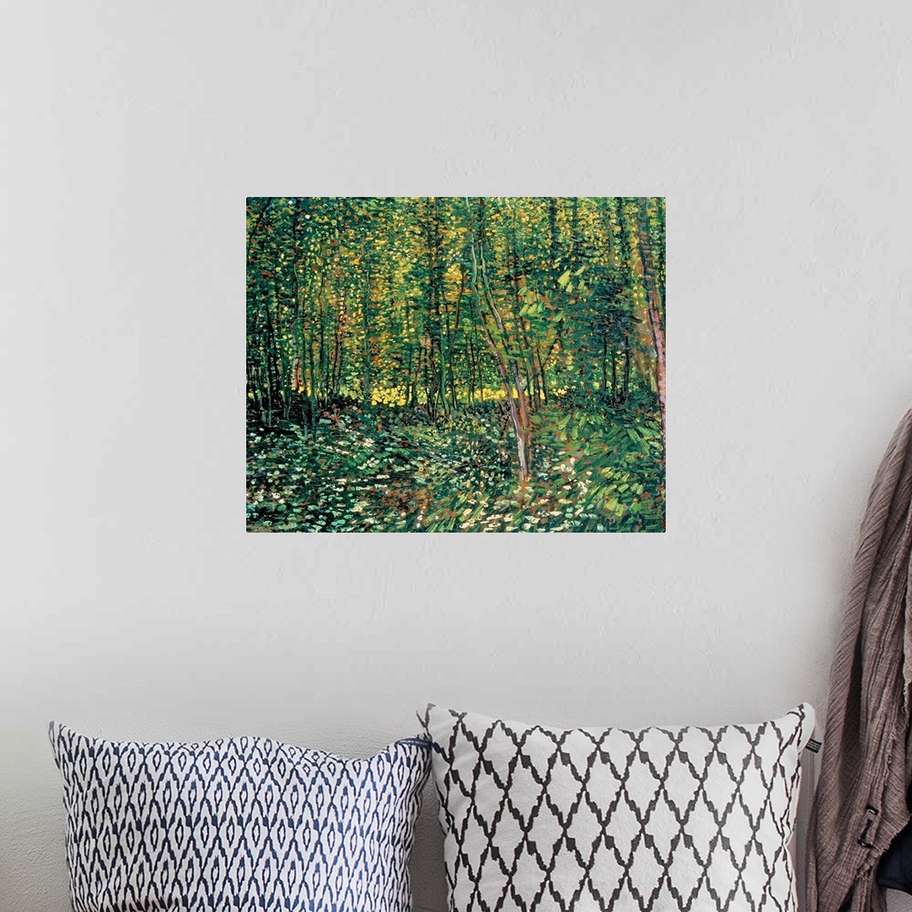 A bohemian room featuring Large classic art depicts a lush forest filled with trees and shrubbery through the use of an abu...