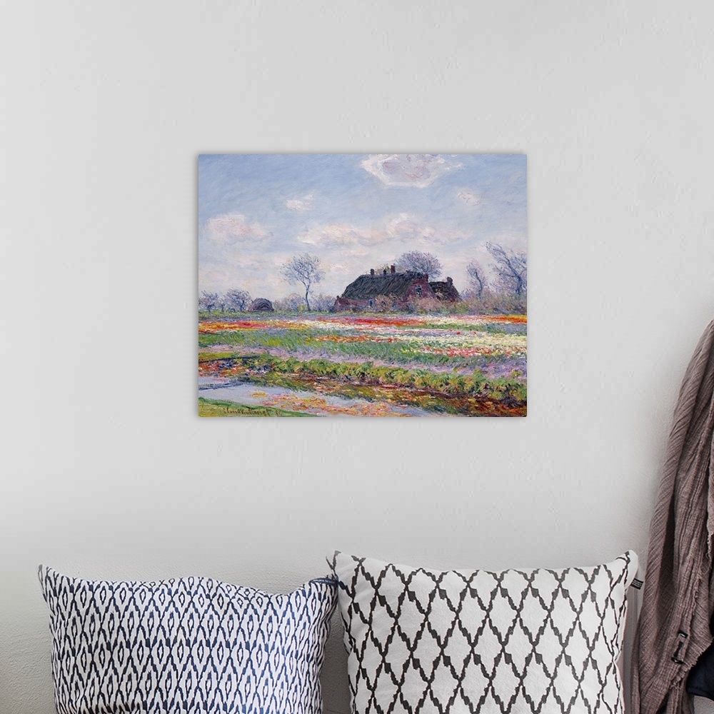 A bohemian room featuring Huge classic art depicts a field in the Netherlands covered in an array of brightly covered flowe...