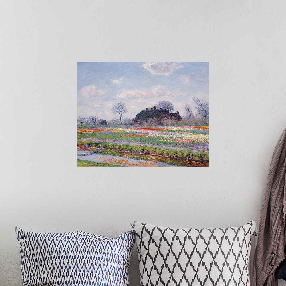 A bohemian room featuring Huge classic art depicts a field in the Netherlands covered in an array of brightly covered flowe...