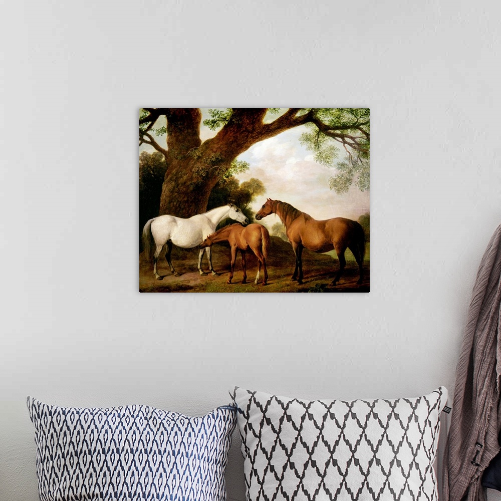 A bohemian room featuring Giant classic art focuses on three horses standing beneath a very large tree on the edge of a for...