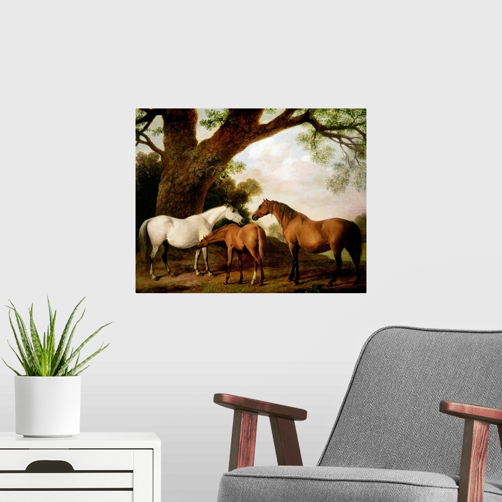 A modern room featuring Giant classic art focuses on three horses standing beneath a very large tree on the edge of a for...