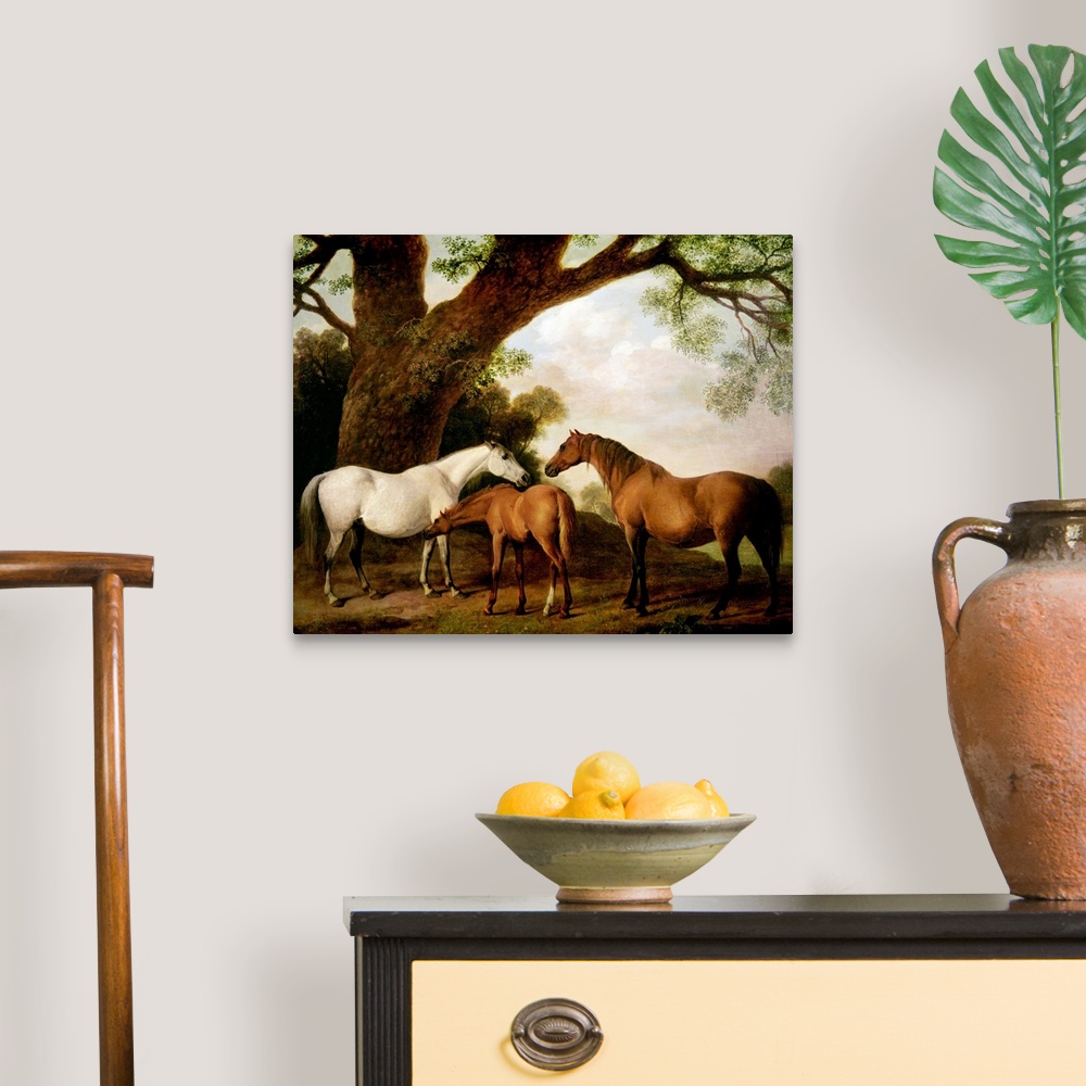 A traditional room featuring Giant classic art focuses on three horses standing beneath a very large tree on the edge of a for...
