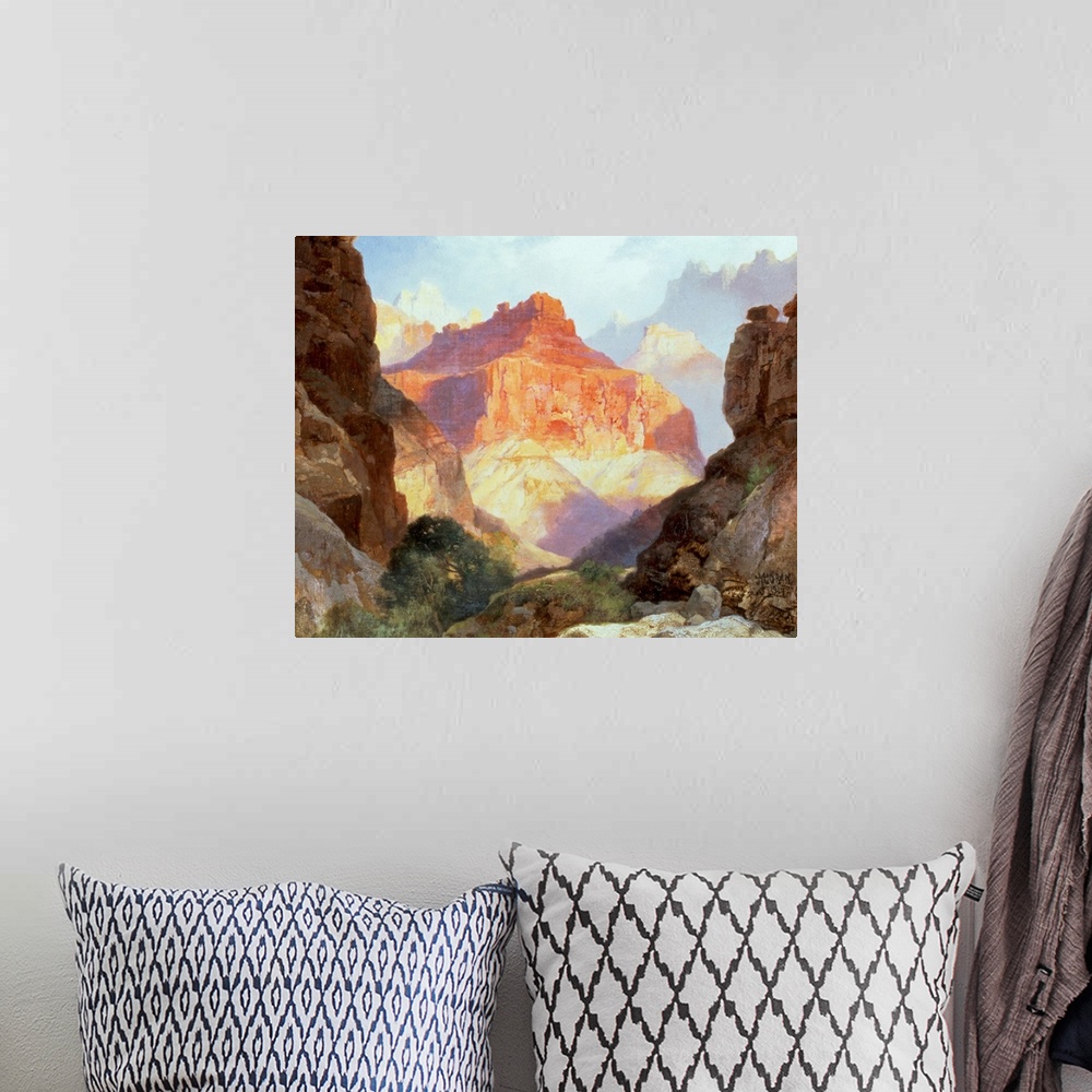 A bohemian room featuring Big, horizontal painting of the Red Wall in the sunlight, surrounded by the large rocky formation...