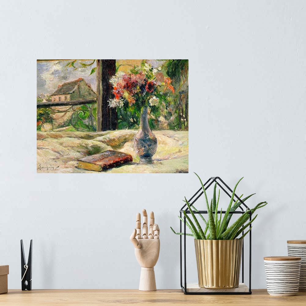 A bohemian room featuring Large impressionalistic painting of a vase of flowers by a book near a window with a cottage outs...