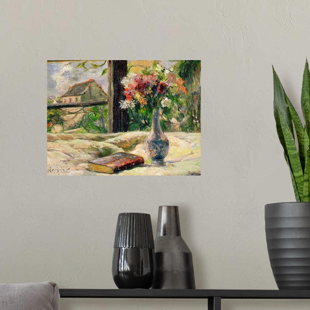 A modern room featuring Large impressionalistic painting of a vase of flowers by a book near a window with a cottage outs...