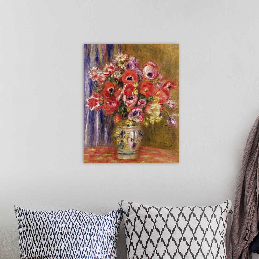 A bohemian room featuring Big painting on canvas of large flowers in a vase on a table.