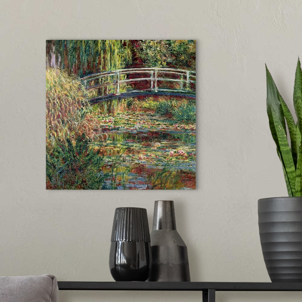 A modern room featuring Landscape painting of a bridge over a garden pond filled with water and marsh plants.