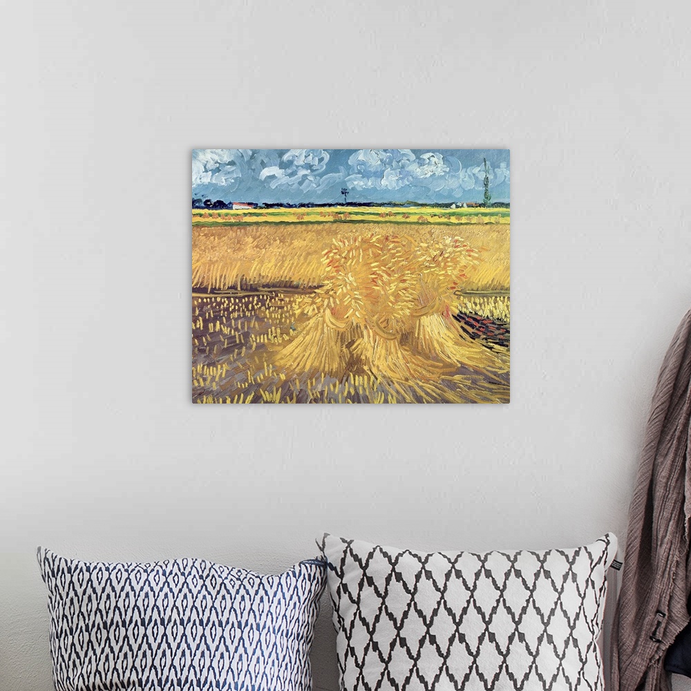 A bohemian room featuring Big, landscape classic painting of a golden wheat filed beneath a blue sky with billowing clouds,...
