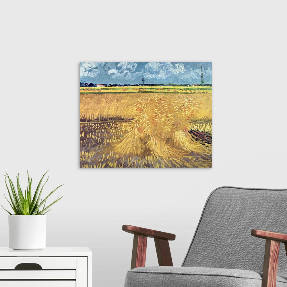 A modern room featuring Big, landscape classic painting of a golden wheat filed beneath a blue sky with billowing clouds,...
