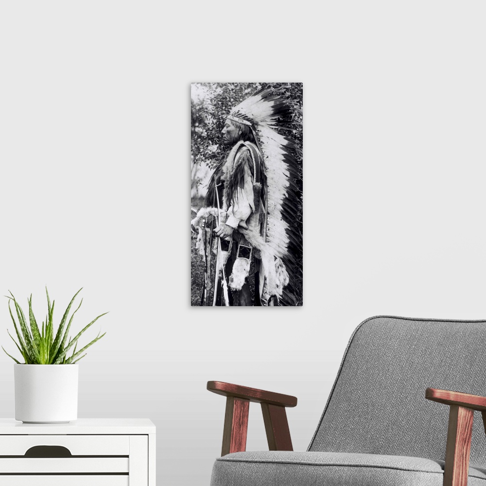 A modern room featuring BAL145755 White Wolf, a Comanche Chief, c.1891-98 (b/w photo) by American School, (19th century);...