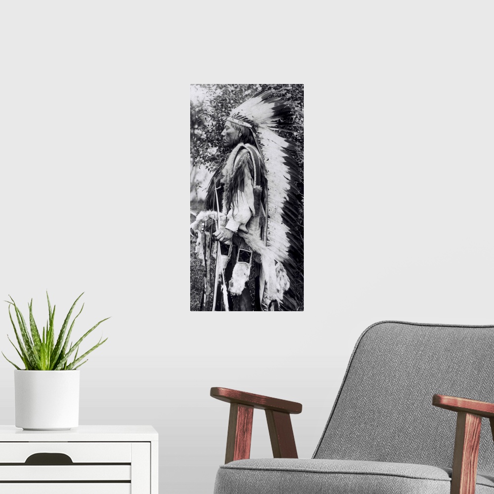 A modern room featuring BAL145755 White Wolf, a Comanche Chief, c.1891-98 (b/w photo) by American School, (19th century);...