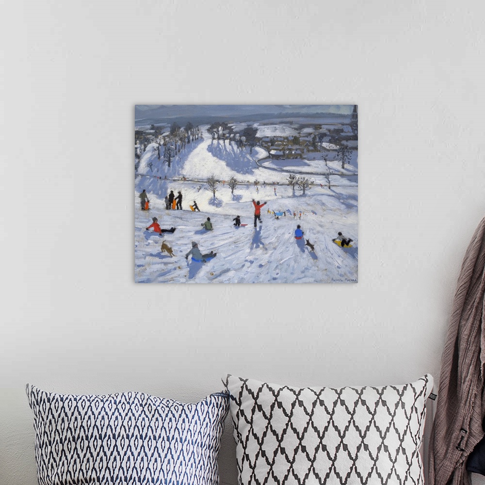 A bohemian room featuring Painting of people with sleds at the top of a snow covered hill overlooking a small town.