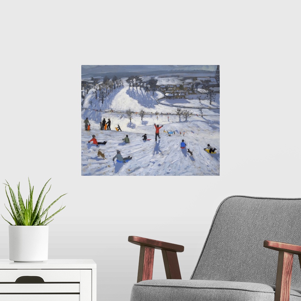 A modern room featuring Painting of people with sleds at the top of a snow covered hill overlooking a small town.