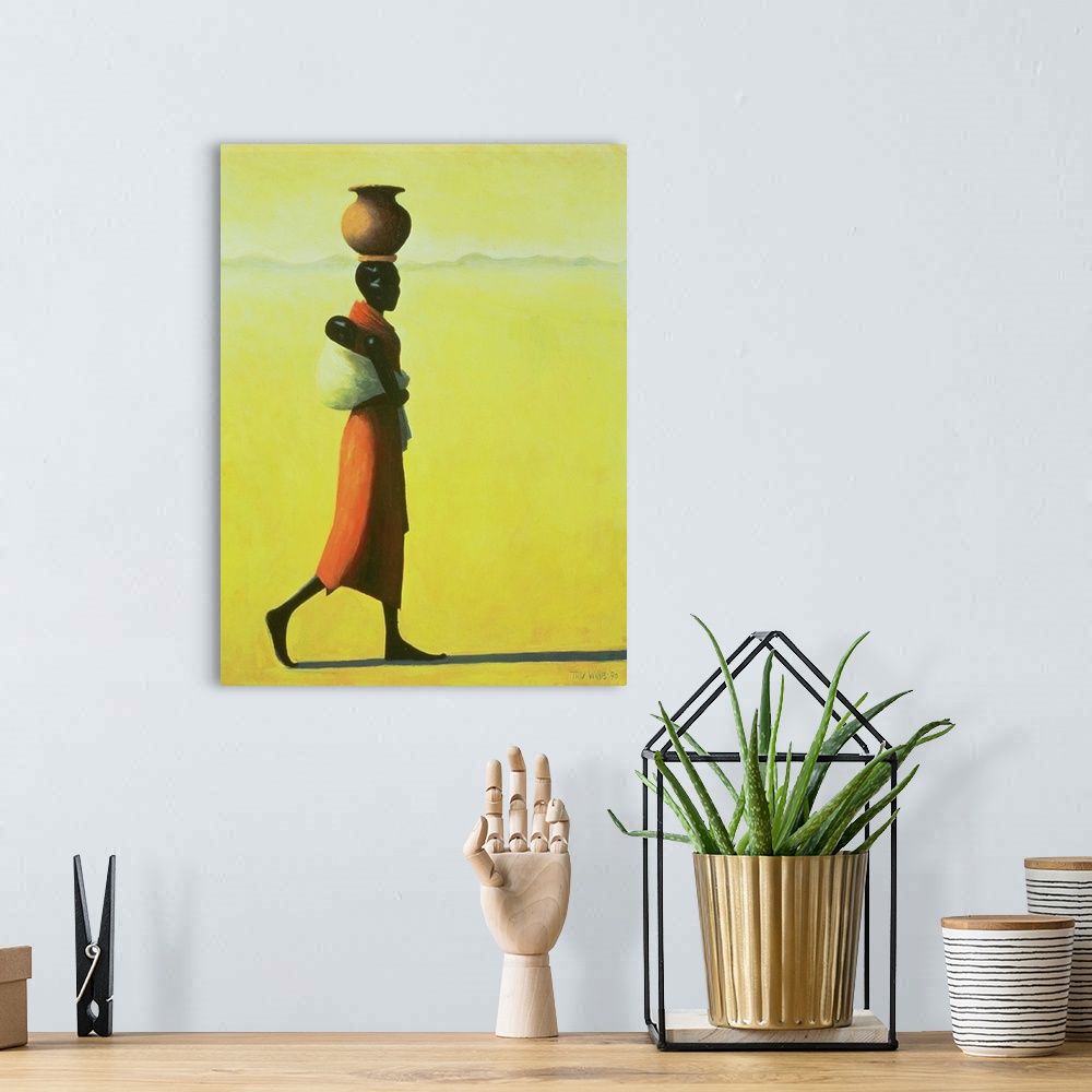 A bohemian room featuring This vertical painting shows a single African woman walking through the desert with an urn balanc...