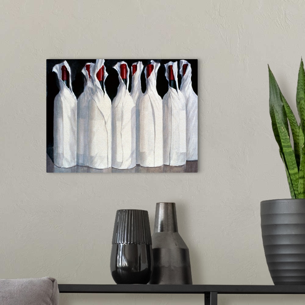 A modern room featuring Horizontal, large artwork of eight wine bottles sitting closely together, wrapped in white paper,...