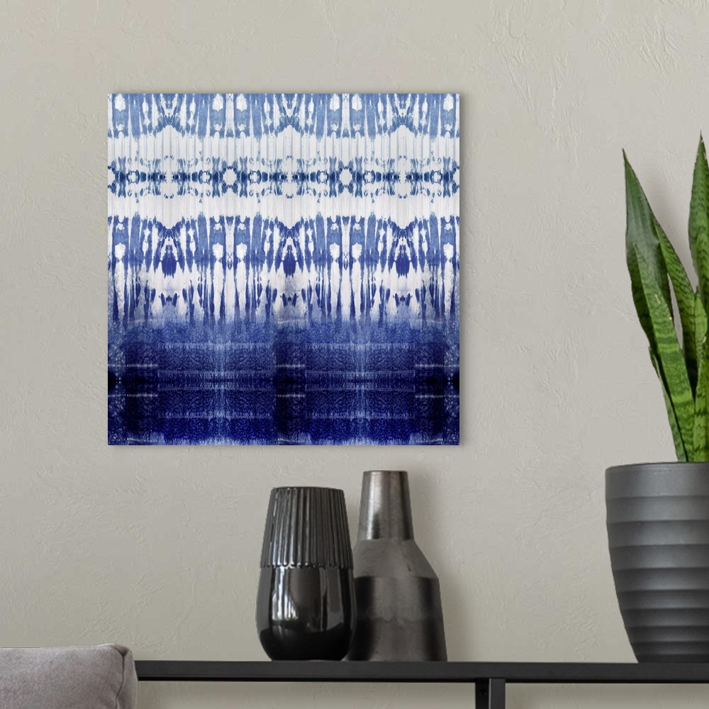 A modern room featuring Square abstract art with a blue and white pattern.