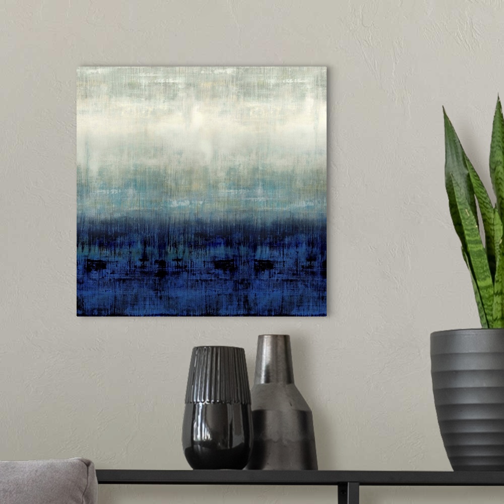 A modern room featuring Square abstract painting in shades of blue, gray, and white.