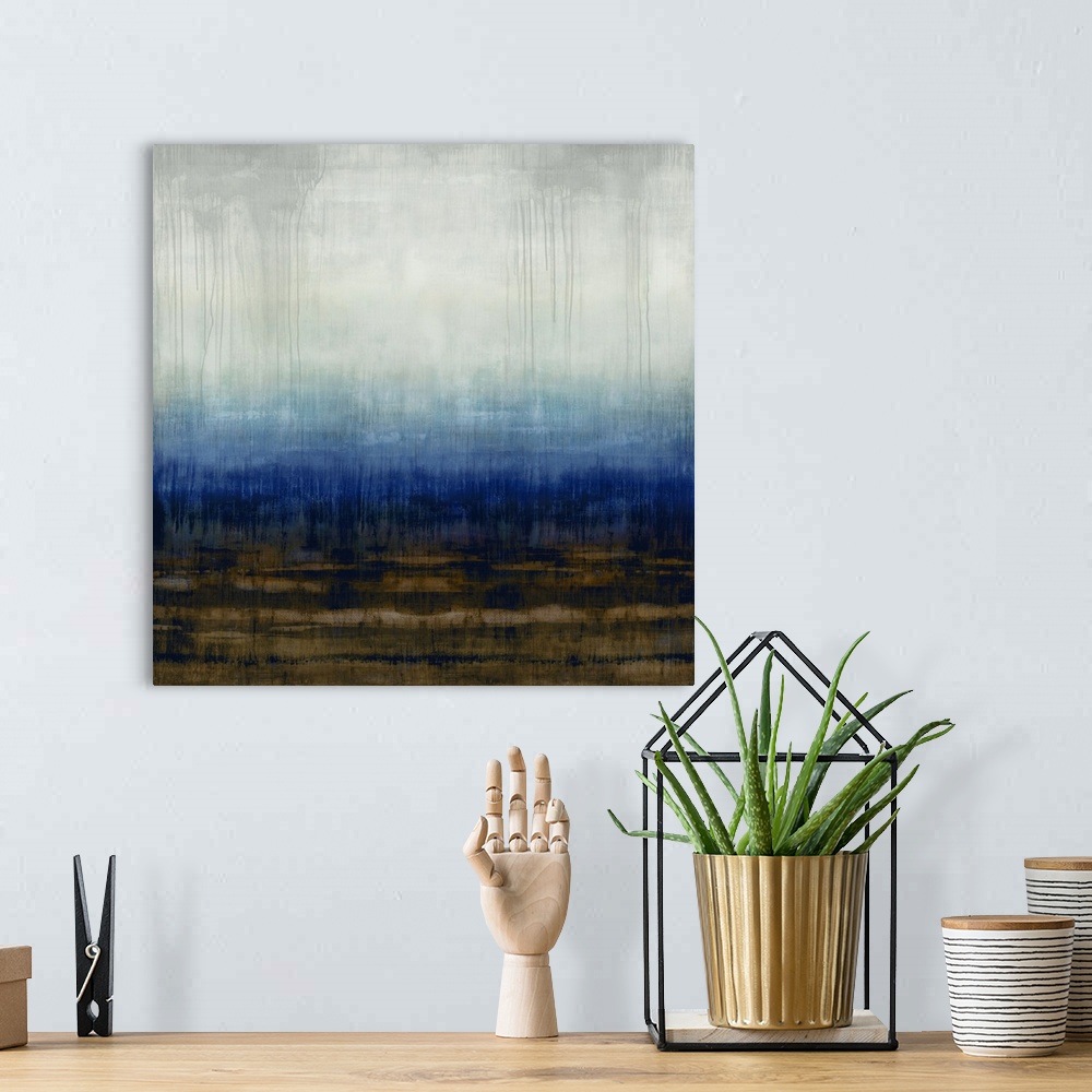 A bohemian room featuring Square abstract painting in shades of blue, brown, gray, and white.
