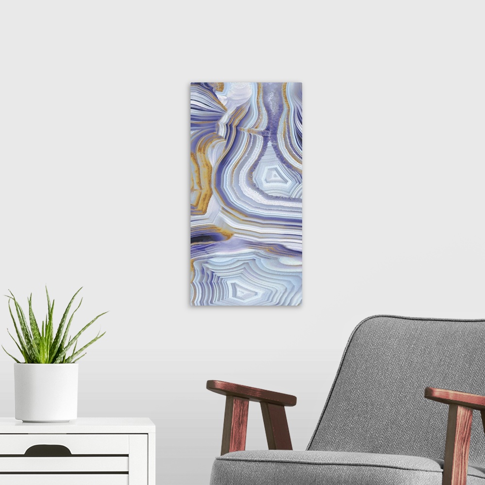 A modern room featuring Tall panel abstract art with a purple, gold, silver, and white agate pattern.