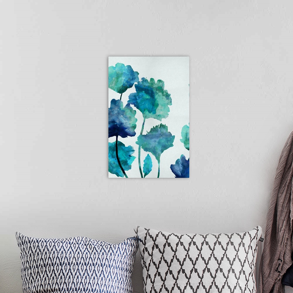 A bohemian room featuring Painting of floral silhouettes in shades of blue and green on a bright white-gray background.