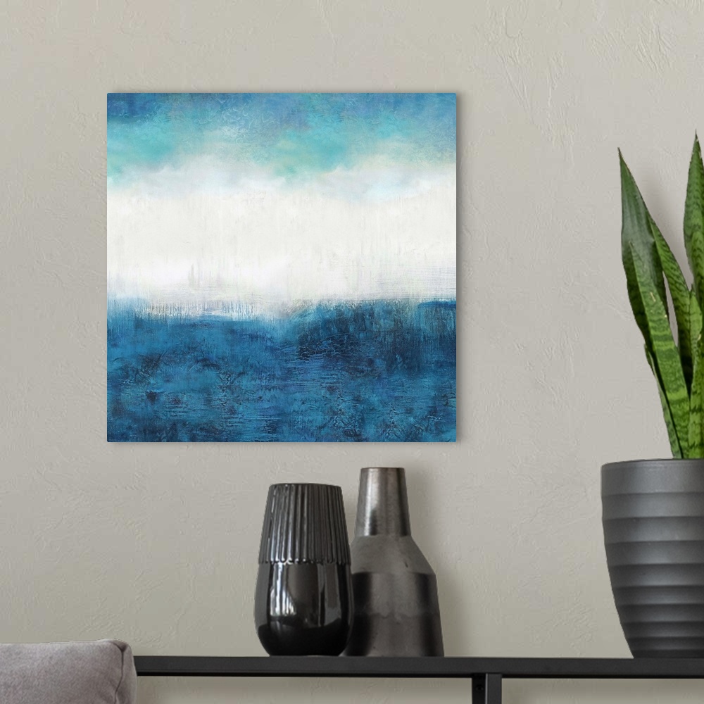A modern room featuring Square abstract painting made with shades of blue and white.