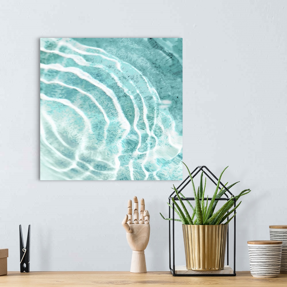 A bohemian room featuring Square photograph of ripples in clear water.