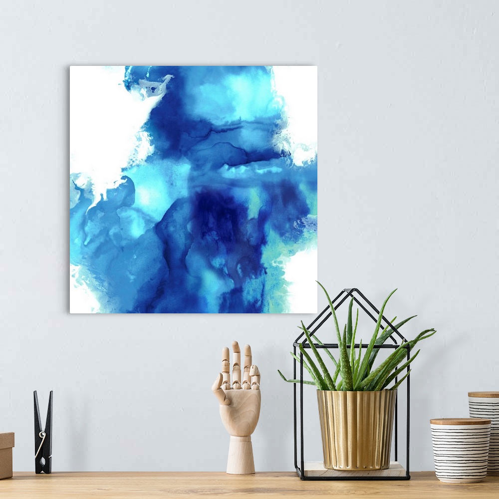 A bohemian room featuring Square abstract art with blue and green on a solid white background.