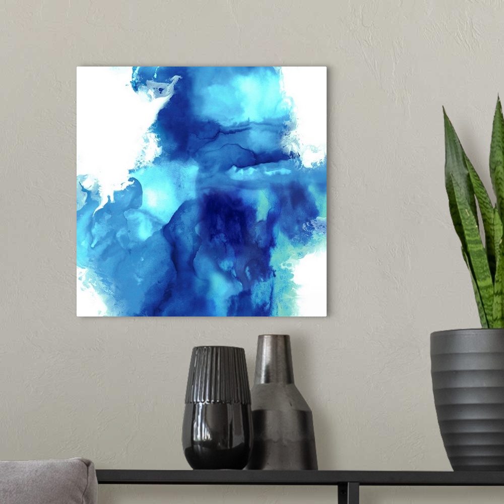 A modern room featuring Square abstract art with blue and green on a solid white background.
