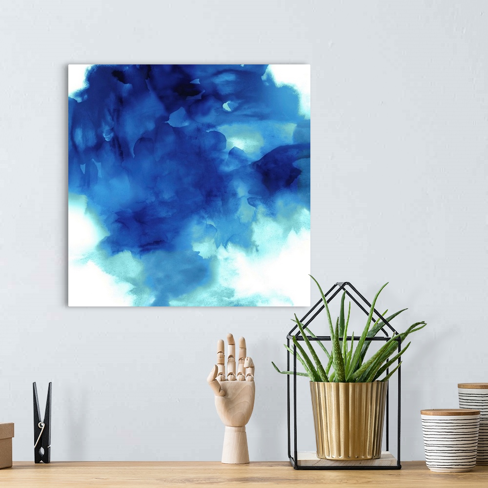 A bohemian room featuring Square abstract art with shades of blue on a solid white background.