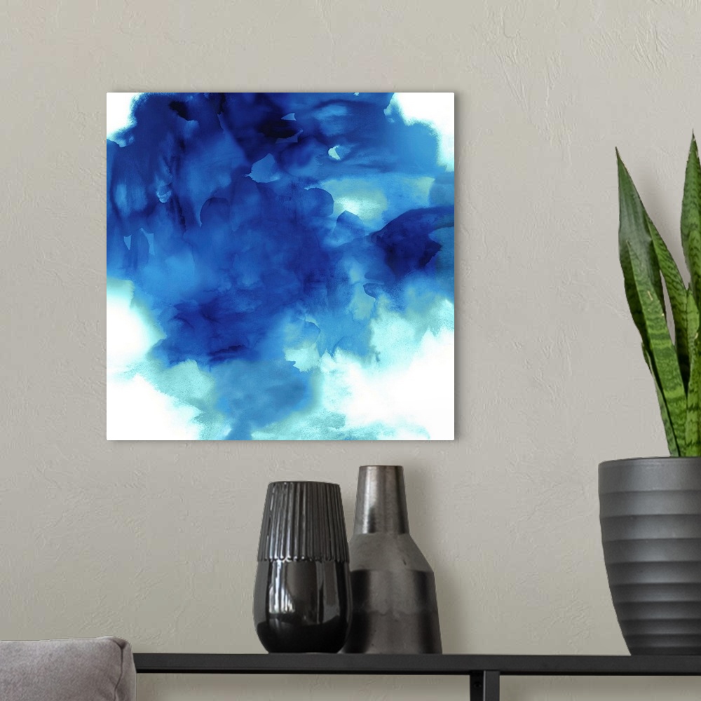 A modern room featuring Square abstract art with shades of blue on a solid white background.