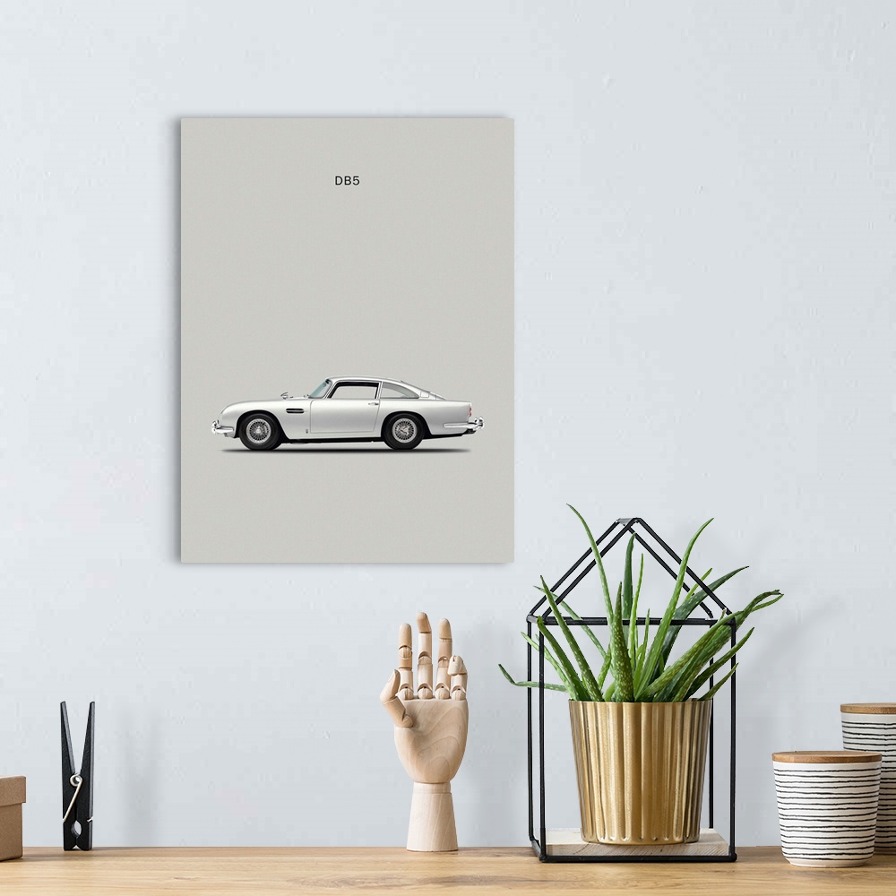 A bohemian room featuring Photograph of a silver Aston DB5 1965 printed on a silver background.