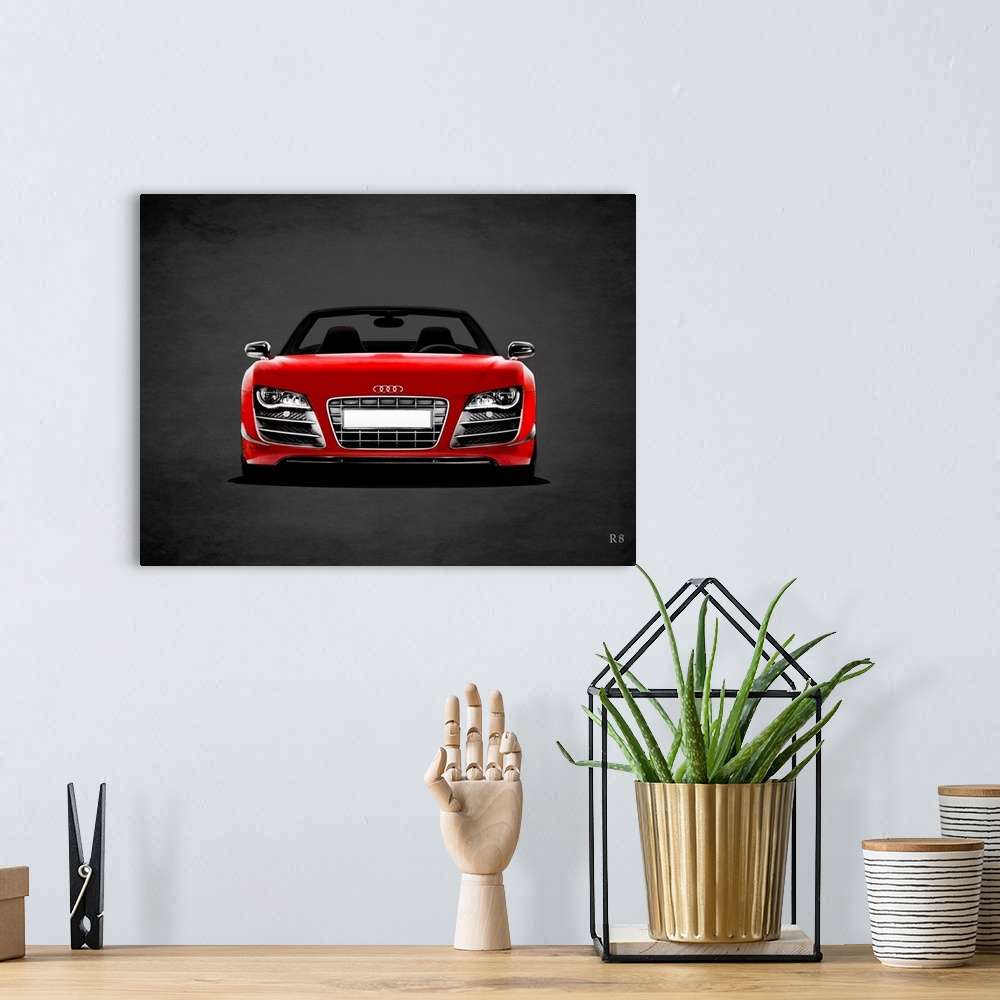 A bohemian room featuring Photograph of a red Audi R8 printed on a black background with a dark vignette.