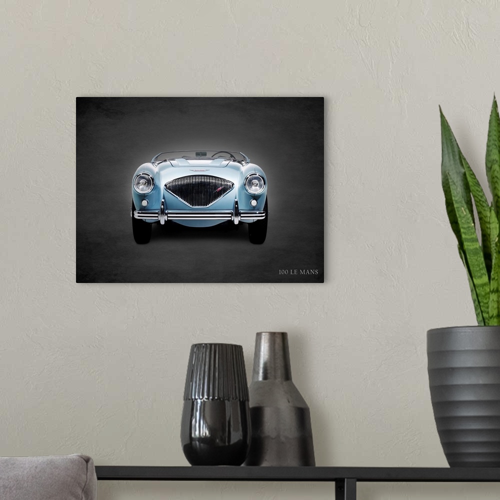 A modern room featuring Photograph of a powder blue 1956 Austin-Healey 100 LeMans printed on a black background with a da...