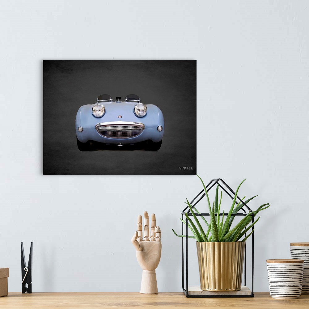 A bohemian room featuring Photograph of a powder blue Austin-Healey Sprite Mk1 printed on a black background with a dark vi...